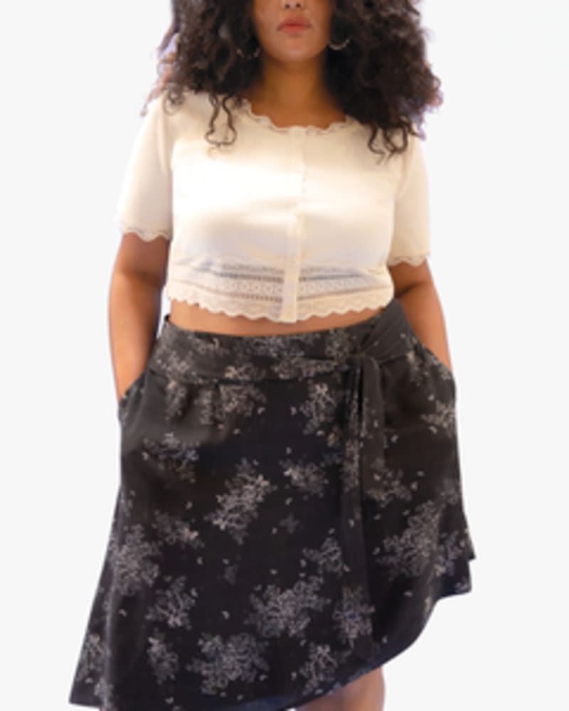 Front of a model wearing a size L Emily Tie-Waist Skirt in FLUTTER by Lovefool. | dia_product_style_image_id:249512